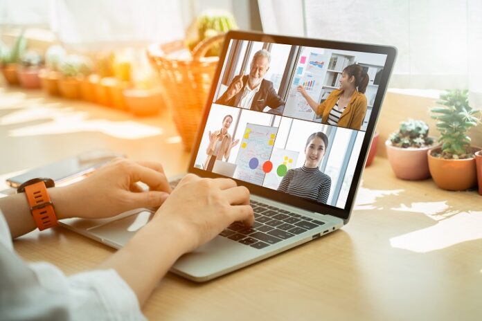 Businesswoman and Business team in video conference for protection covid-19.woman watching laptop webinar video course at home office.Webinar,social distancing,e learning and seminar online Concept. Online college